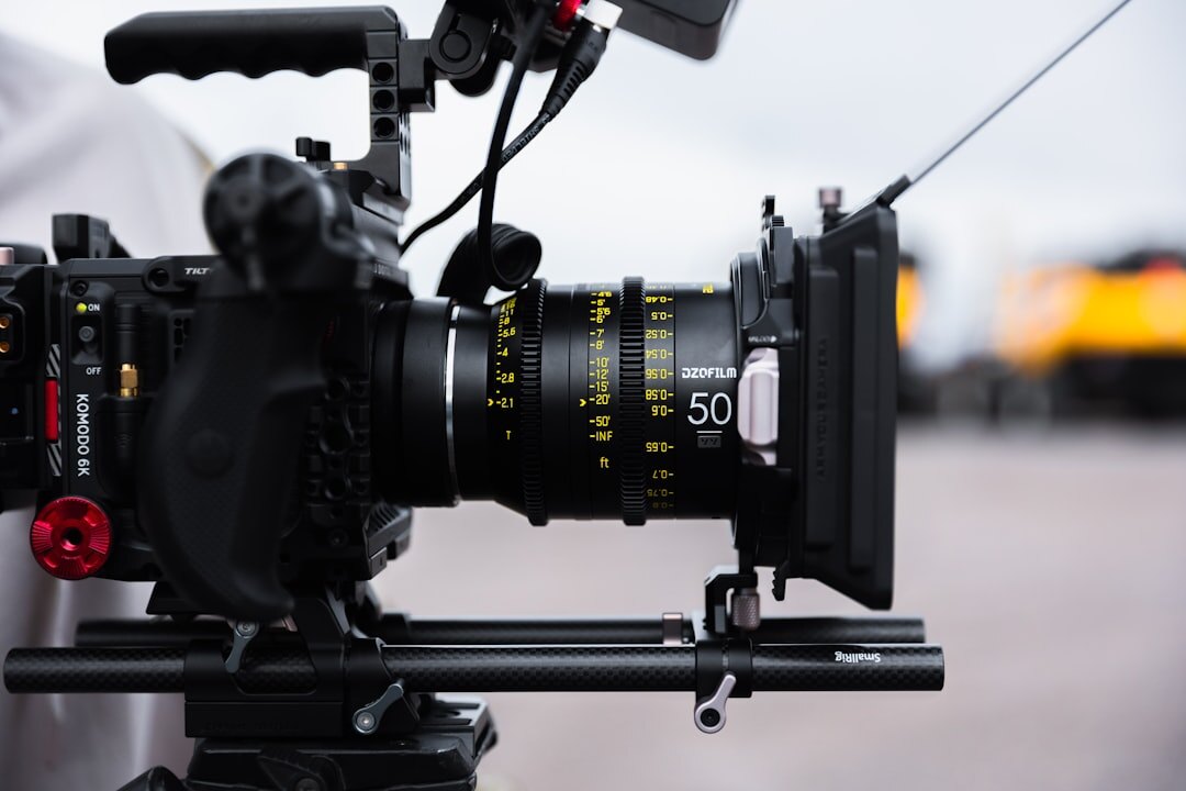 Close-up of a broadcast camera lens in a television studio