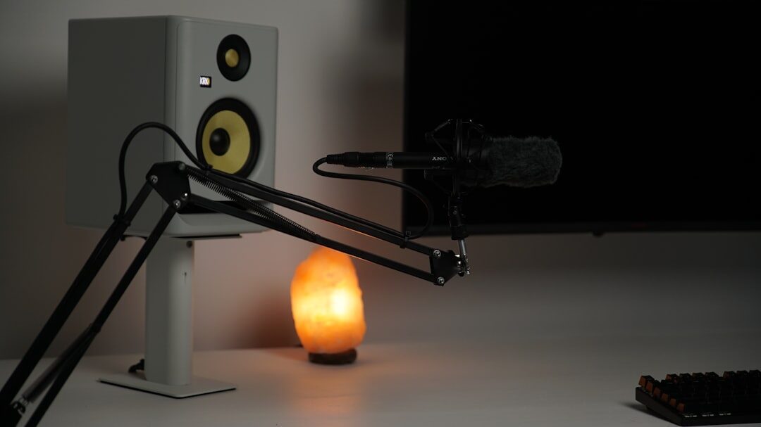 Streaming setup with microphone, camera and computer monitors in a studio