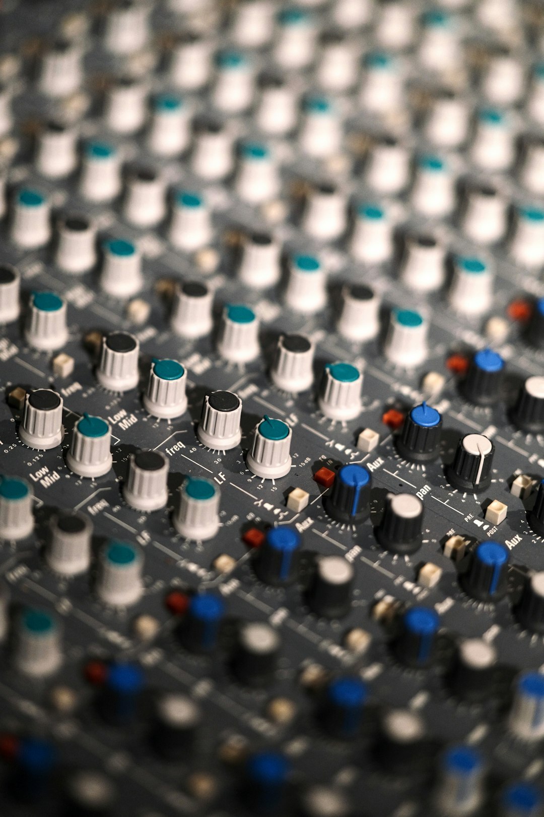 Audio mixing desk with faders inside a broadcast studio