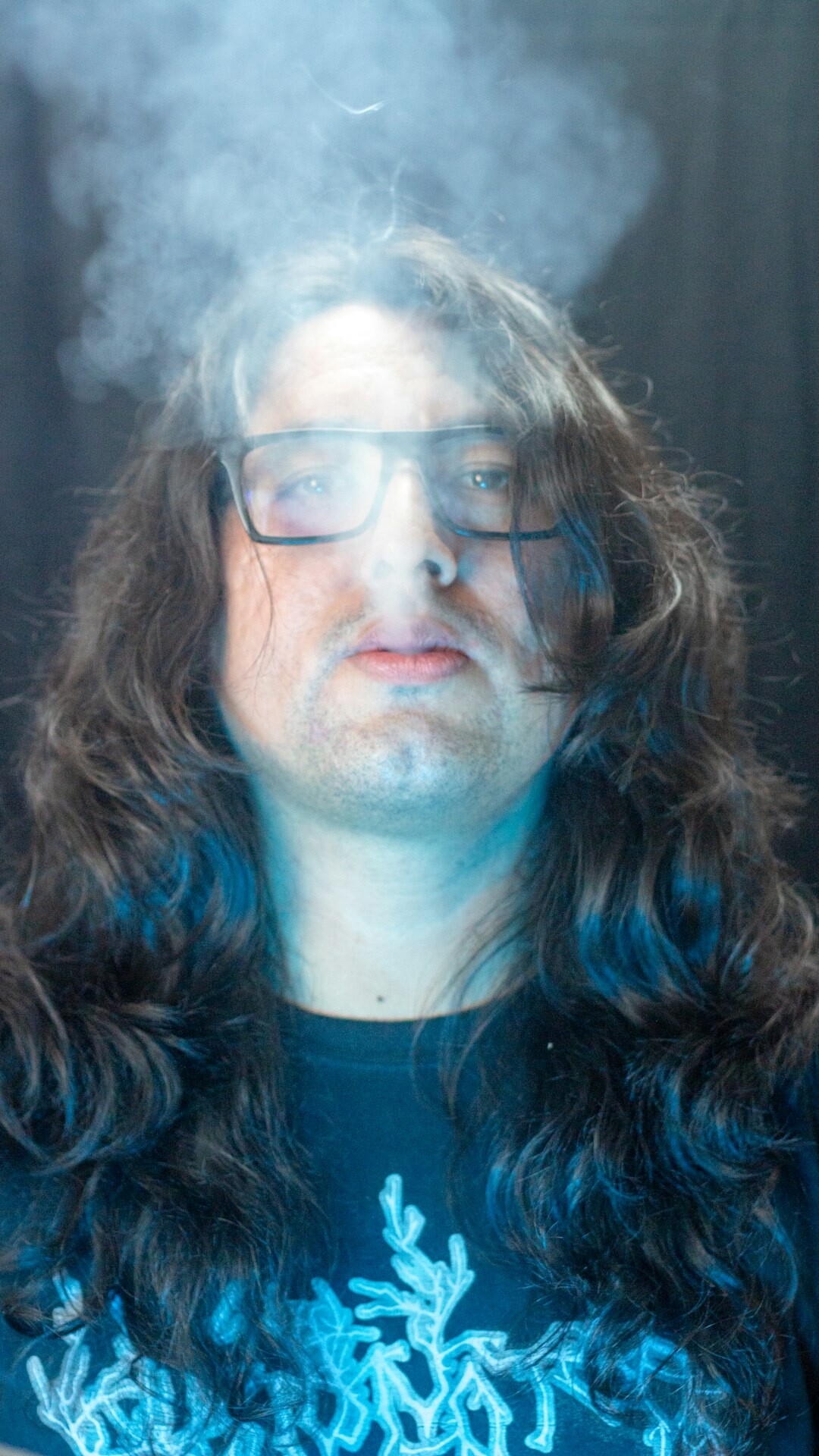 Studio portrait of a middle aged Finnish man wearing glasses